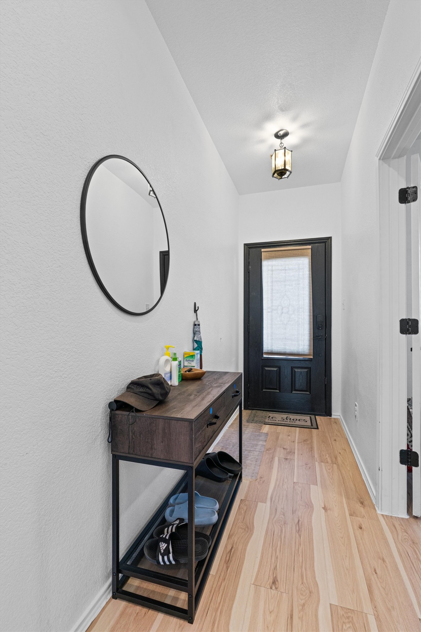 327 Andesite Trail Buda, TX 78610 - Photo 4 of 40 Entryway featuring baseboards and light wood-type flooring