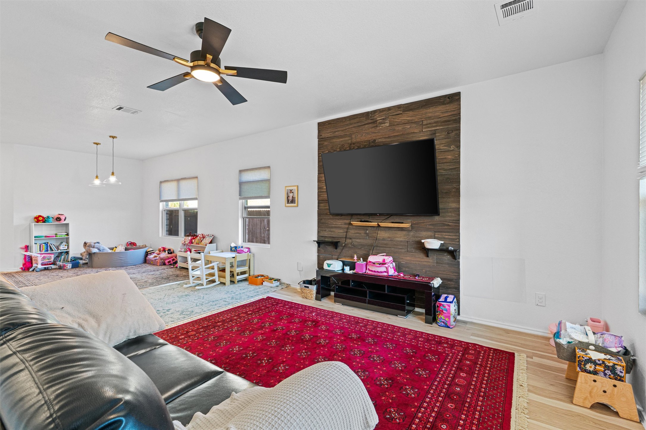 327 Andesite Trail Buda, TX 78610 - Photo 6 of 40 a living room with furniture and a flat screen tv