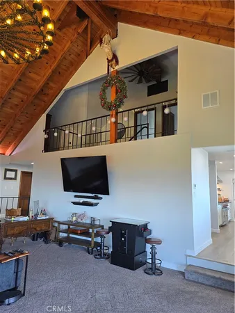 a bedroom with furniture and a wooden floor