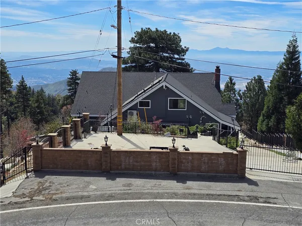 a view of a house with a snow in the yard