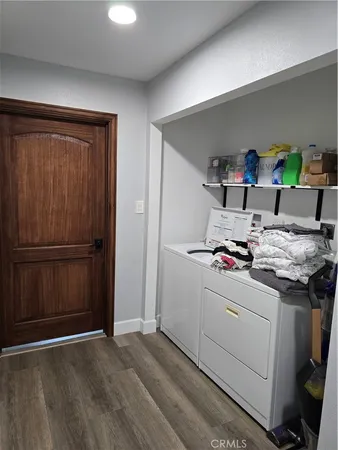 a view of a balcony with a floor to ceiling window and tree