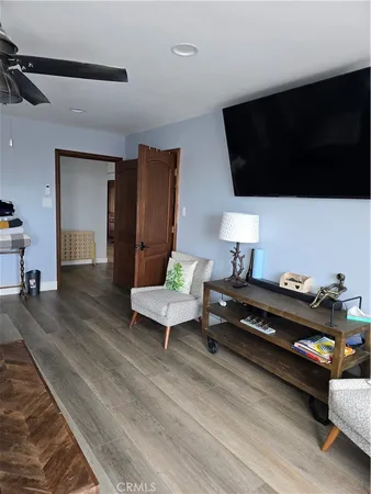 a hallway with a couch and a window