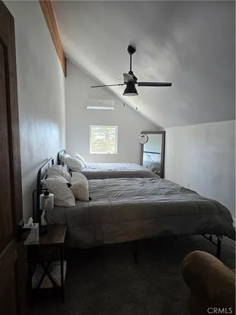 a view of a balcony with furniture and wooden floor