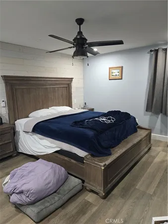 a view of a backyard with wooden fence