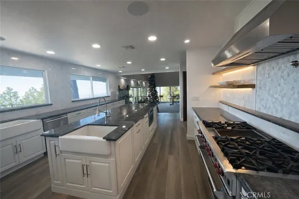 a work room with furniture and a chandelier