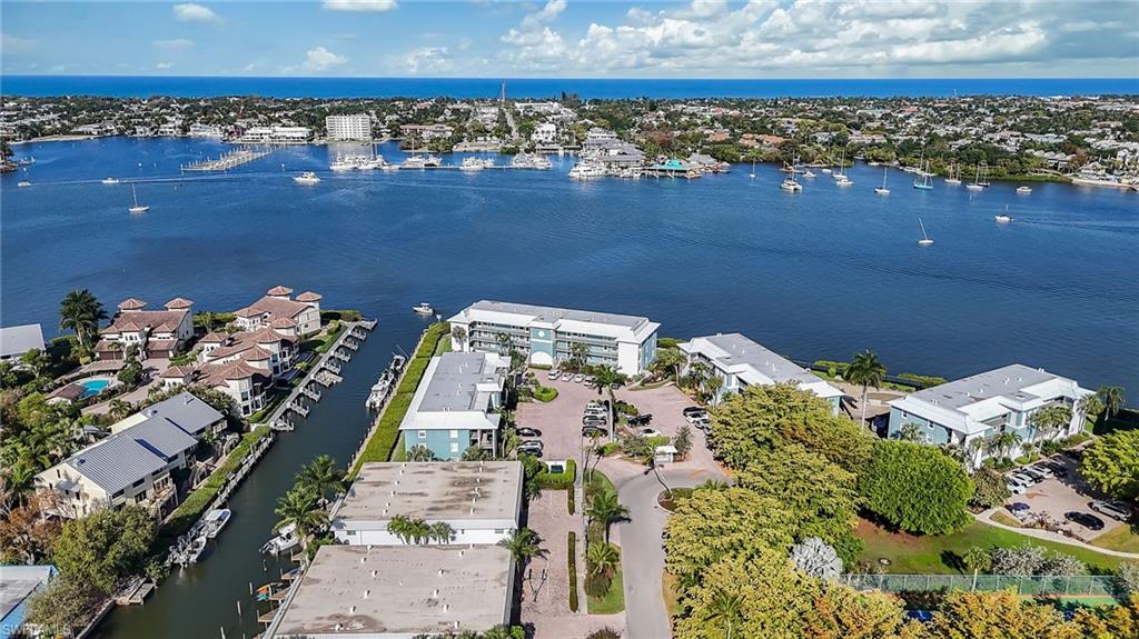 1200 Blue Point Avenue, Unit A2 Naples, FL 34102 - Photo 29 of 30 An aerial view showcasing the property's waterfront location, with views of the bay and the distant ocean