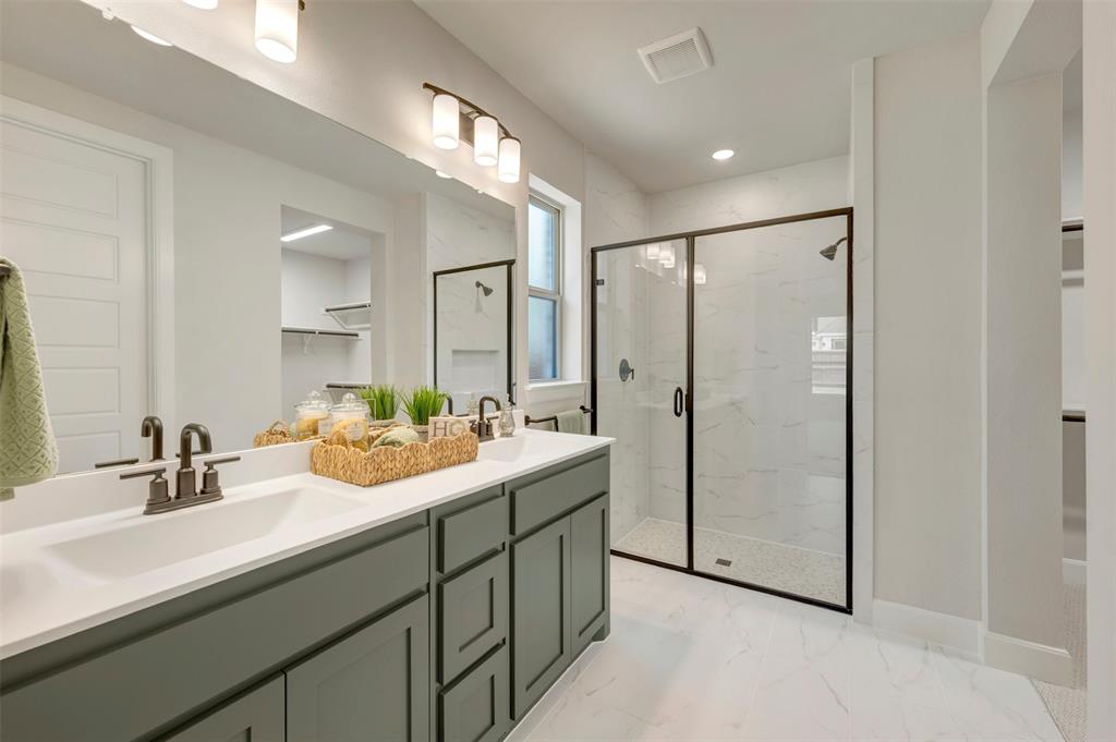 4308 Palomino Road Aubrey, TX 76227 - Photo 29 of 40 a bathroom with a double vanity sink mirror and double