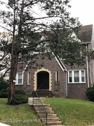 a front view of a house with garden