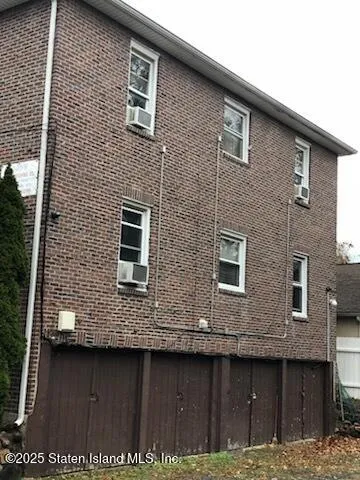 a front view of a house with large windows