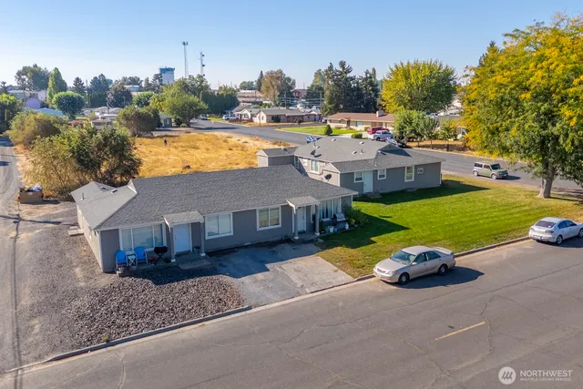 a view of a house with swimming pool and porch with furniture