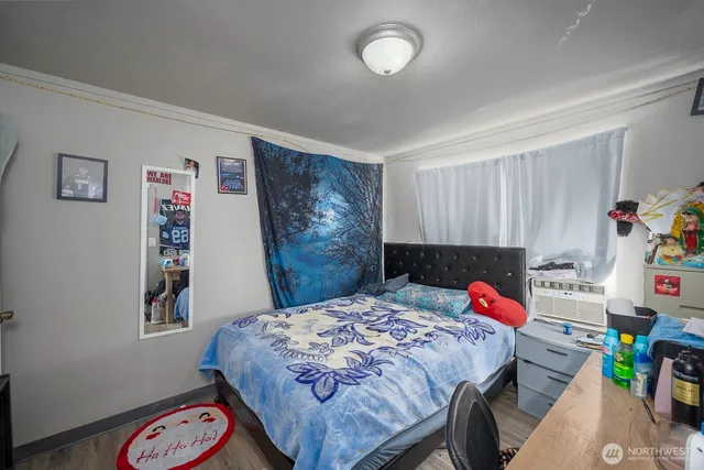 a bedroom with a bed and furniture