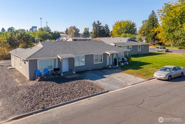 a view of house with outdoor space and car parked