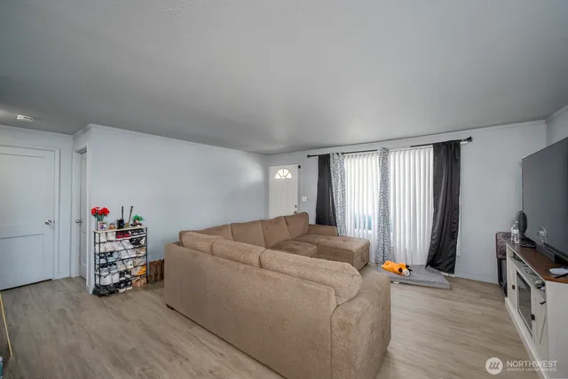 a bed room with a bed and a tv