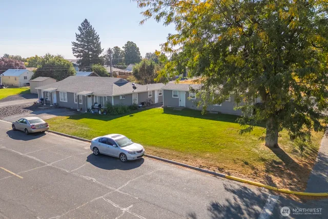 a view of a swimming pool and lounge chairs