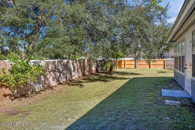 a view of a yard with patio