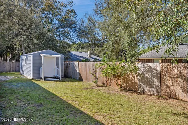 a view of a backyard with a house