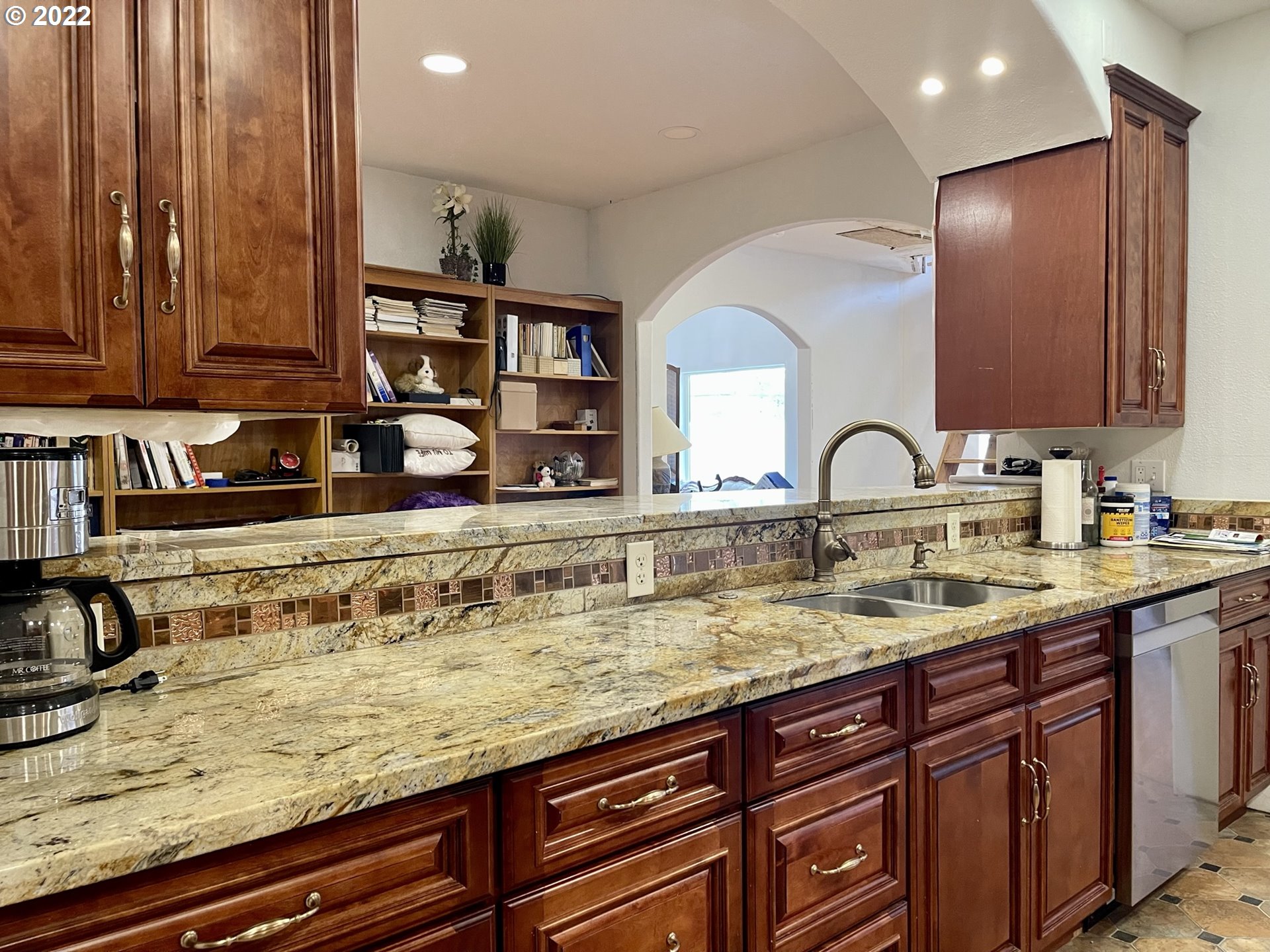 66325 North Bay Road North Bend, OR 97459 - Photo 14 of 31 a kitchen with sink and mirror