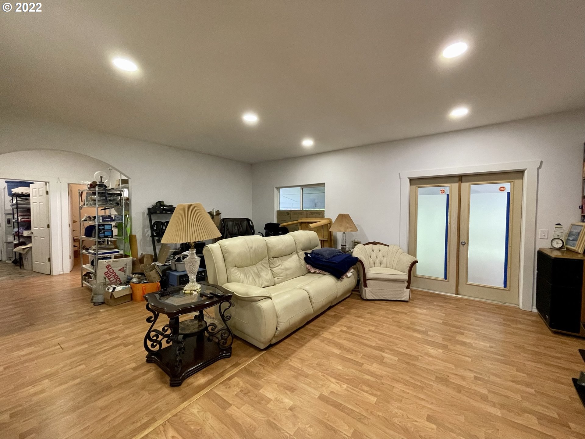 66325 North Bay Road North Bend, OR 97459 - Photo 19 of 31 a bed room with furniture and a wooden floor