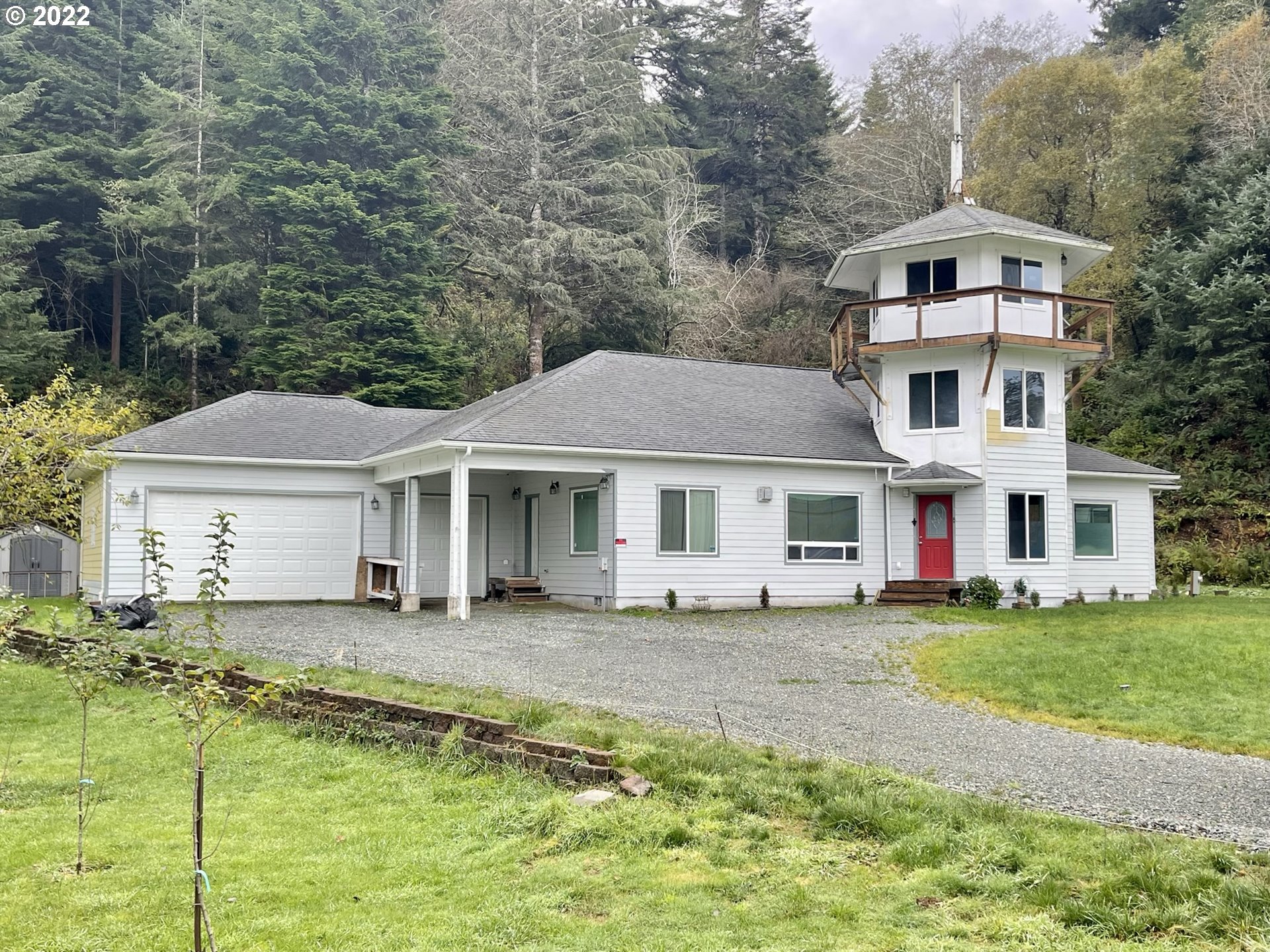 66325 North Bay Road North Bend, OR 97459 - Photo 2 of 31 a front view of a house with a yard