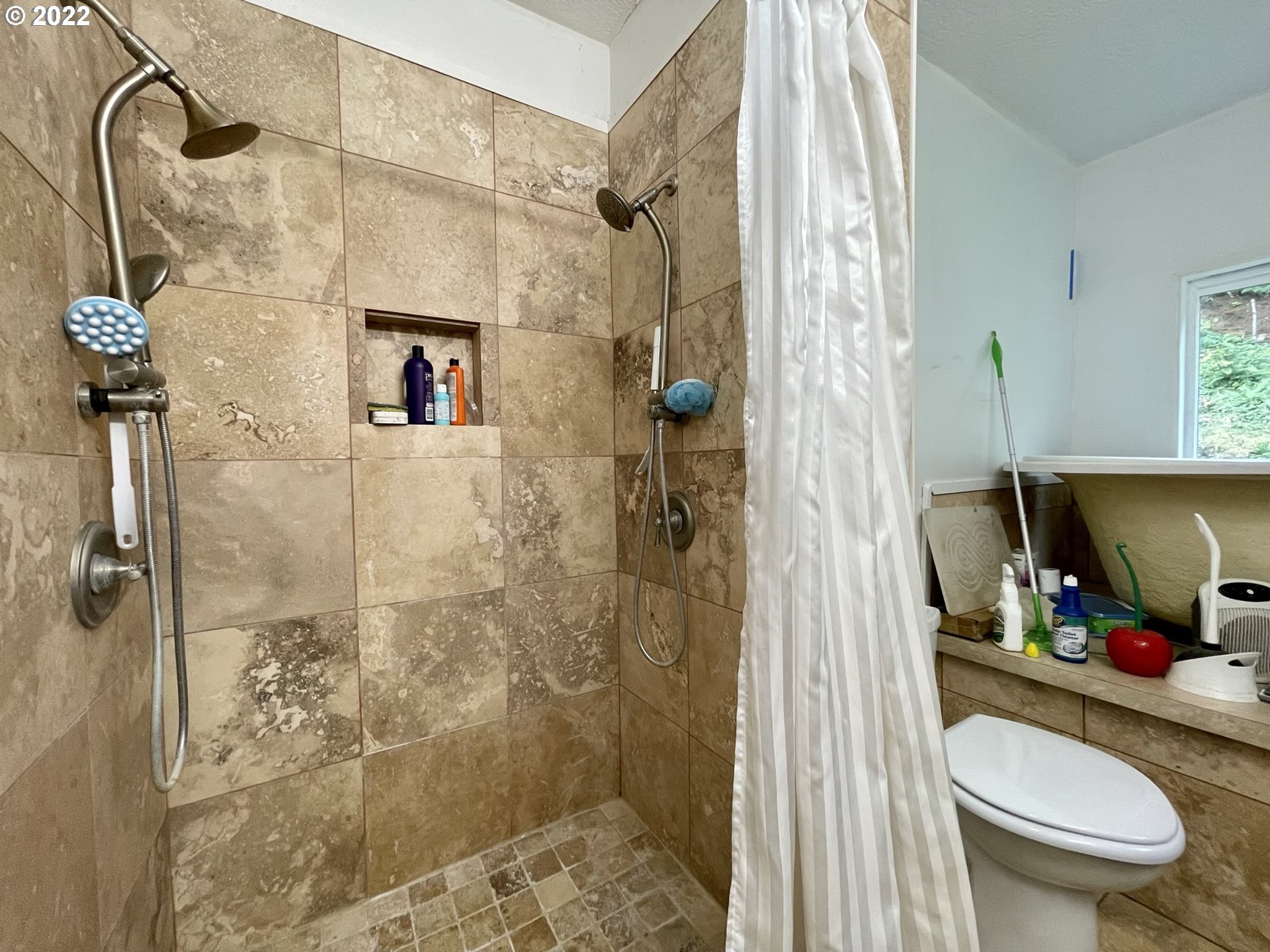 66325 North Bay Road North Bend, OR 97459 - Photo 23 of 31 a bathroom with a sink toilet and shower