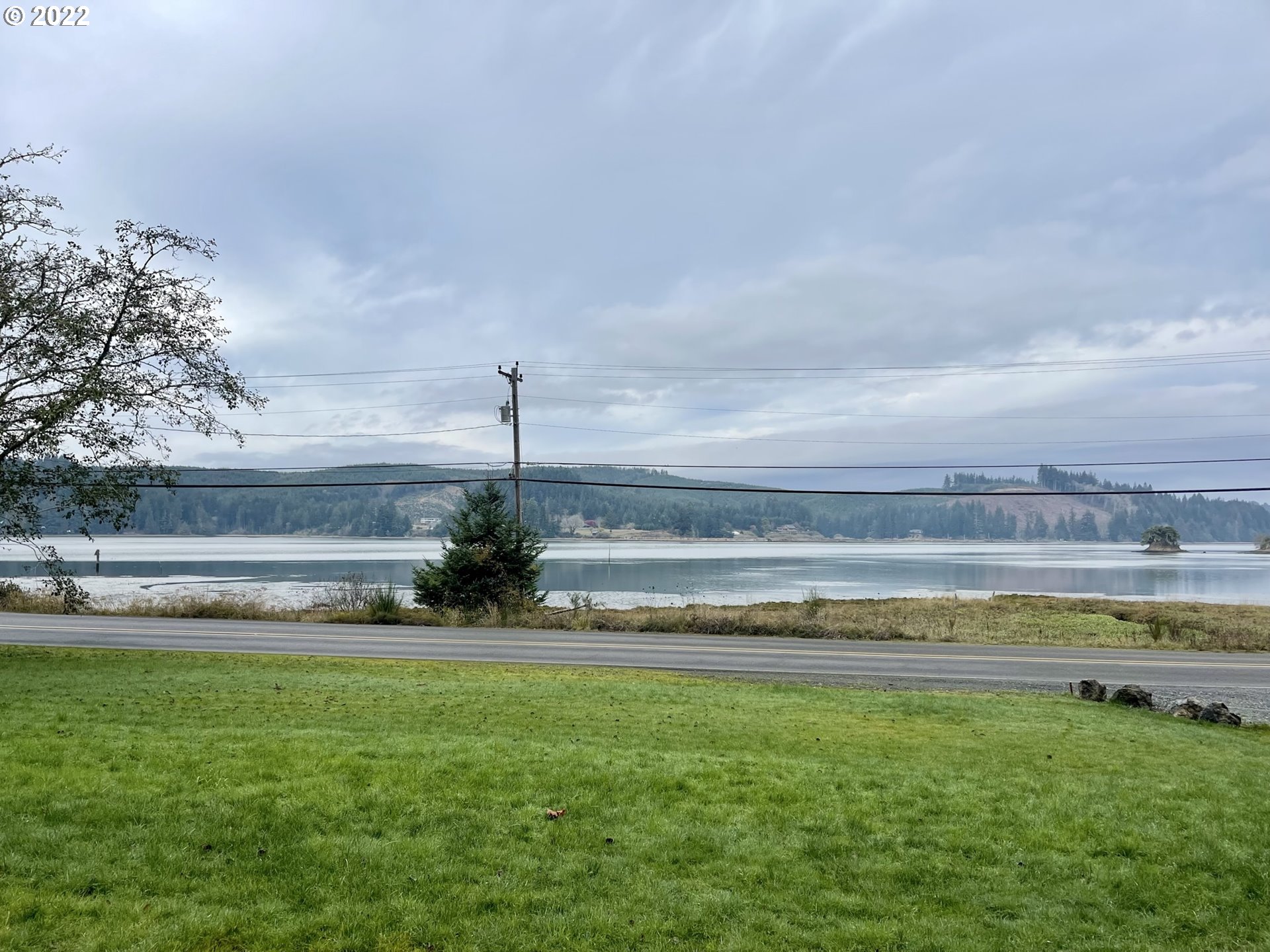 66325 North Bay Road North Bend, OR 97459 - Photo 4 of 31 a view of a garden and lake view