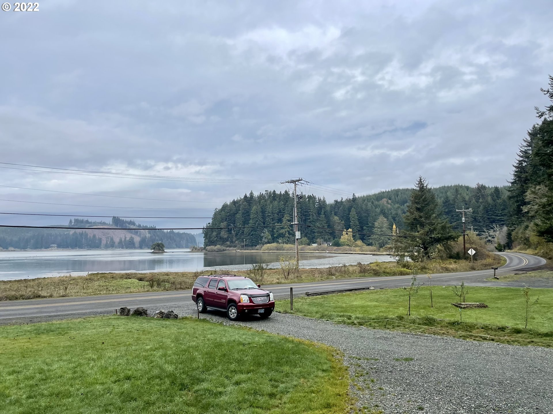 66325 North Bay Road North Bend, OR 97459 - Photo 5 of 31 a view of yard with car parked