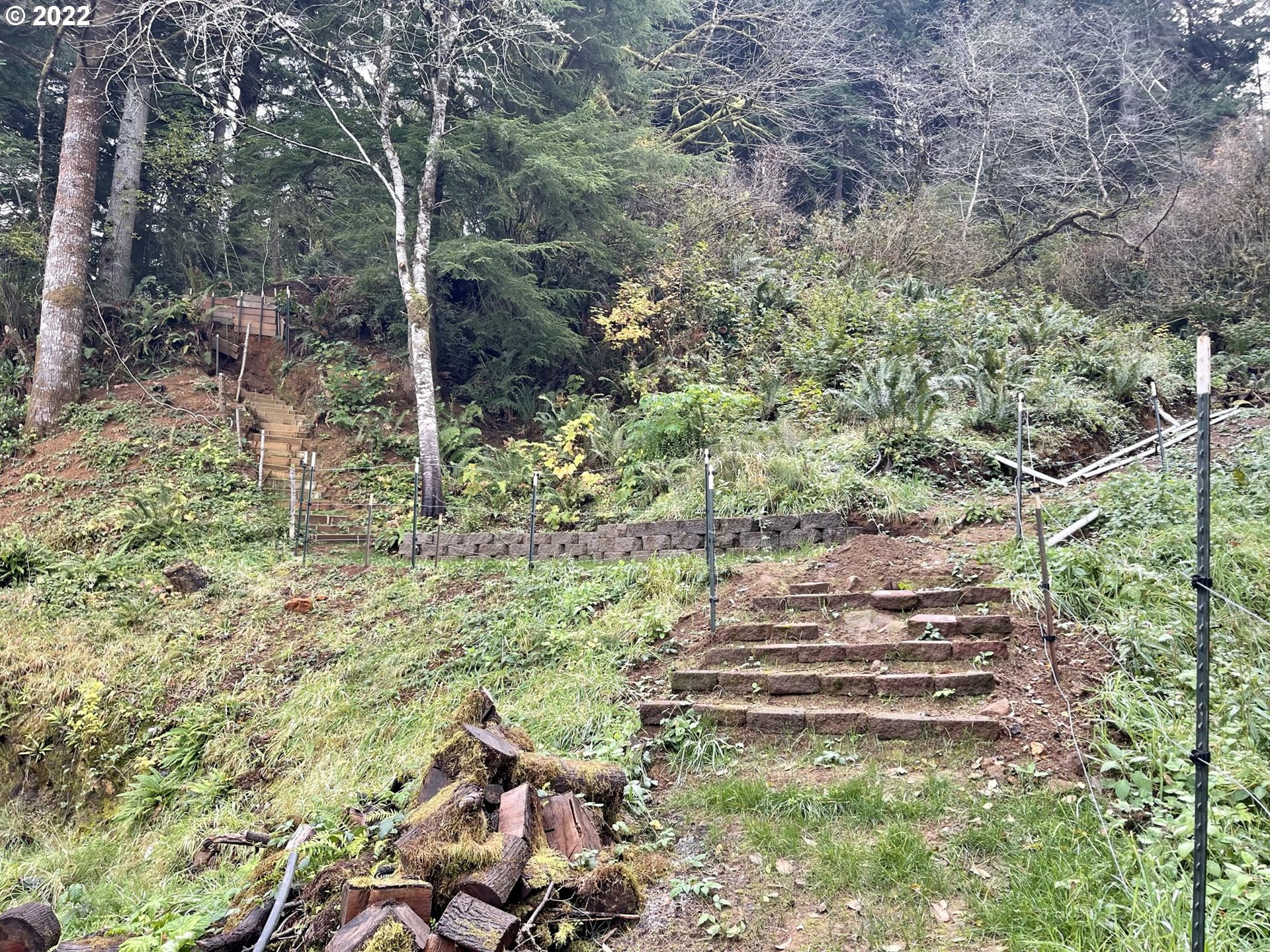 66325 North Bay Road North Bend, OR 97459 - Photo 6 of 31 a backyard of a house with lots of green space