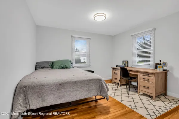 a bedroom with a bed and a table