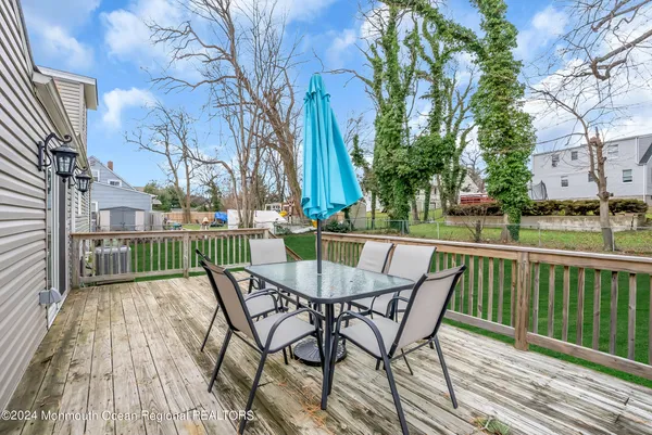 a view of a chairs and table on the wooden floor