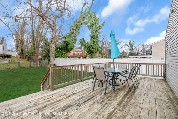 a view of a deck with a table and chairs and wooden floor