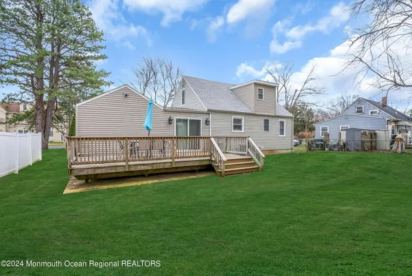 a view of a house with a yard porch and sitting area