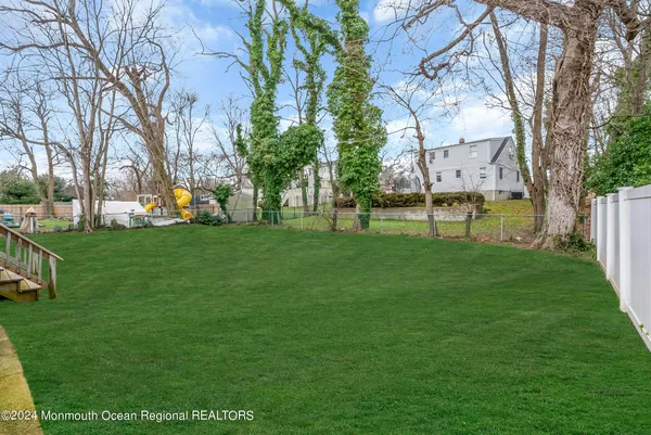 a view of a park with large trees