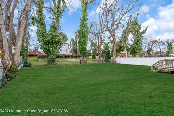 a view of a park with large trees