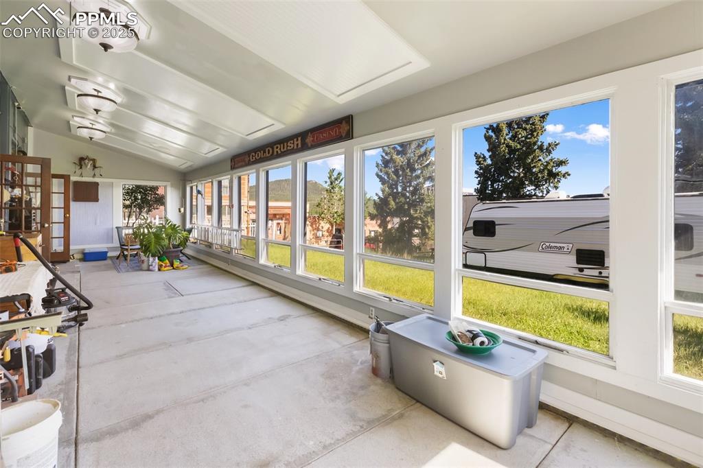 119 South 3rd Street Victor, CO 80860 - Photo 22 of 38 a living room with furniture and floor to ceiling windows