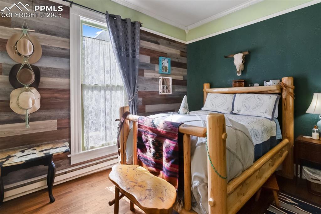 119 South 3rd Street Victor, CO 80860 - Photo 30 of 38 a bed sitting in a bedroom next to a window