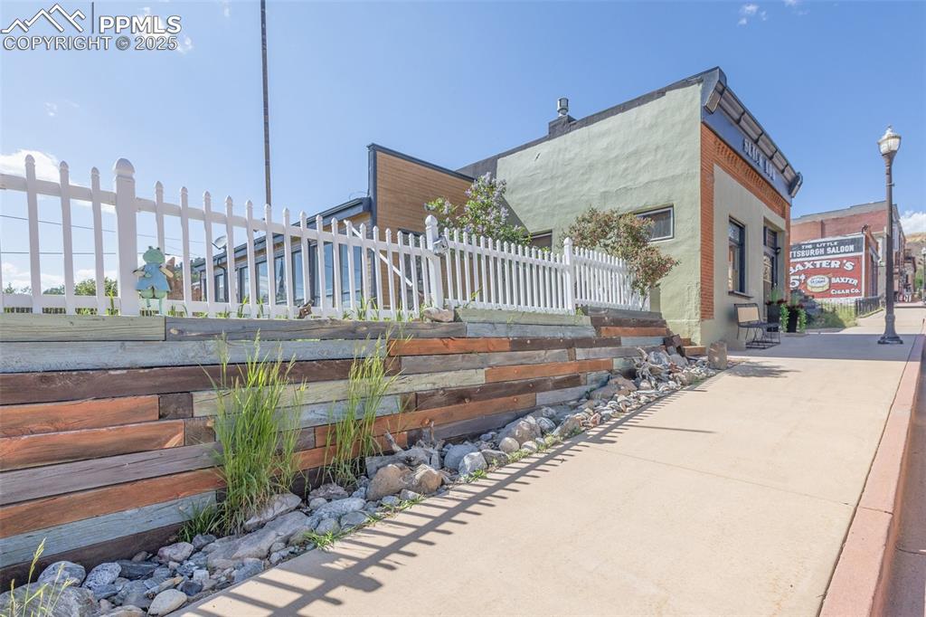 119 South 3rd Street Victor, CO 80860 - Photo 3 of 38 a view of a house with a yard