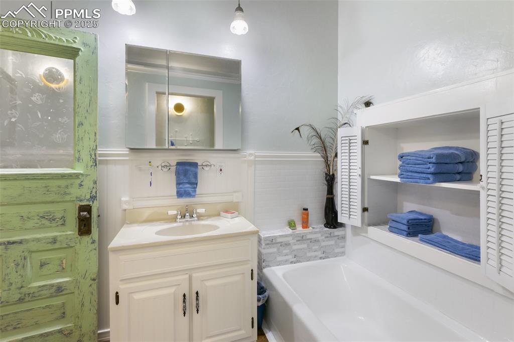 119 South 3rd Street Victor, CO 80860 - Photo 31 of 38 a bathroom with a sink and a mirror