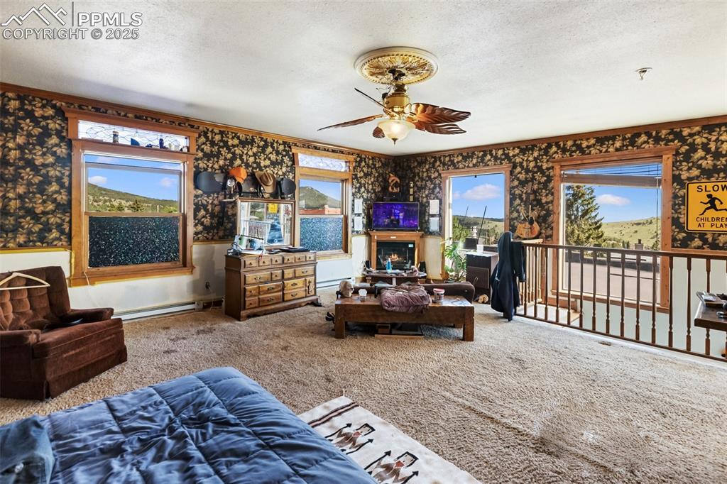 119 South 3rd Street Victor, CO 80860 - Photo 35 of 38 a living room with furniture and a large window