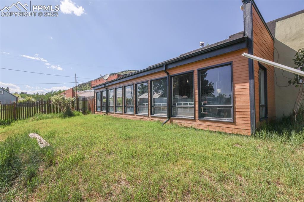 119 South 3rd Street Victor, CO 80860 - Photo 5 of 38 a view of a house with backyard and porch