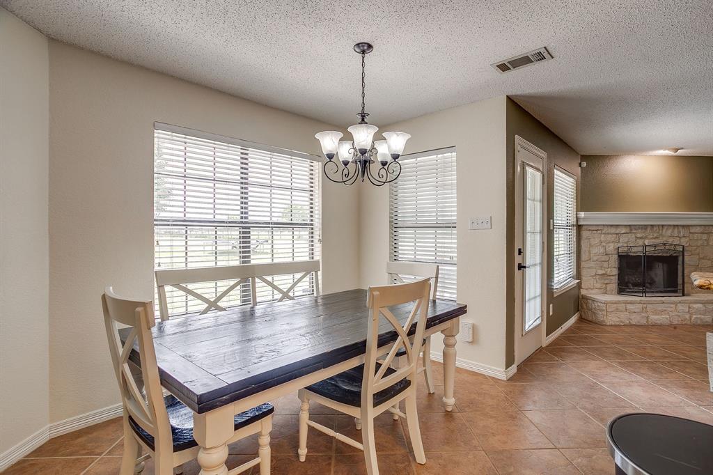 1050 Hampel Road Palmer, TX 75152 - Photo 13 of 35 a dining room with furniture a chandelier and wooden floor