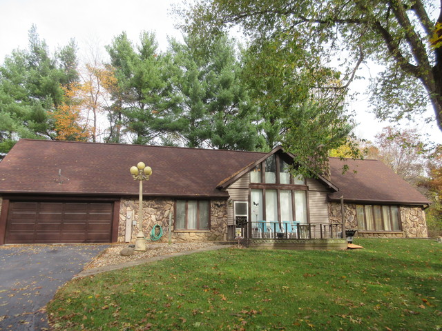 6680 South Anterier Road Dixon, IL 61021 - Photo 1 of 21 a front view of a house with a garden and pathway
