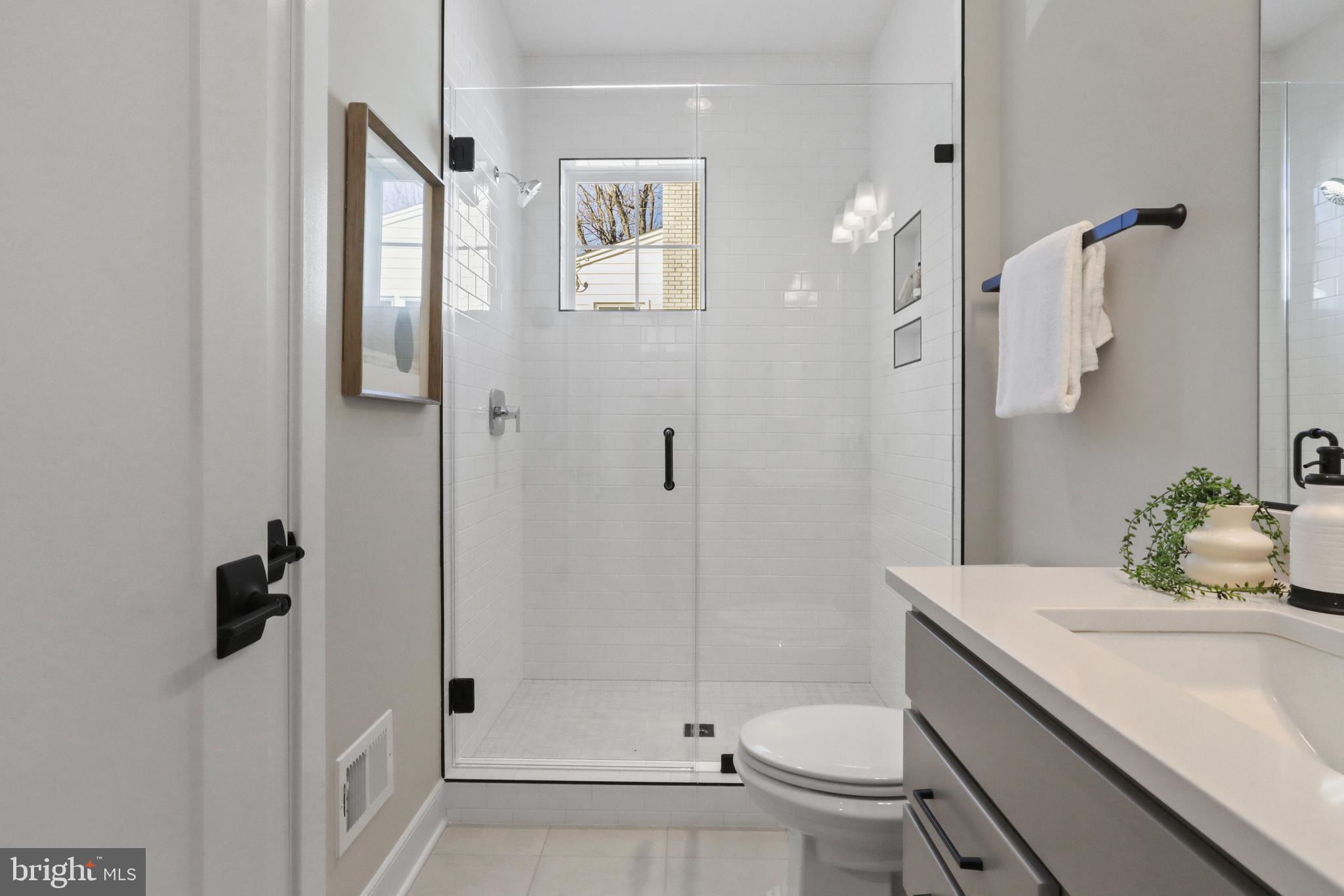 611 Tapawingo Road Southwest Vienna, VA 22180 - Photo 12 of 55 a bathroom with a sink toilet and shower