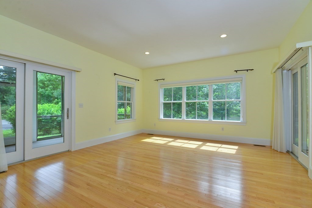15 Hathaway Pond Circle, Unit 15 Rochester, MA 02770 - Photo 12 of 36 a view of empty room with wooden floor and fan