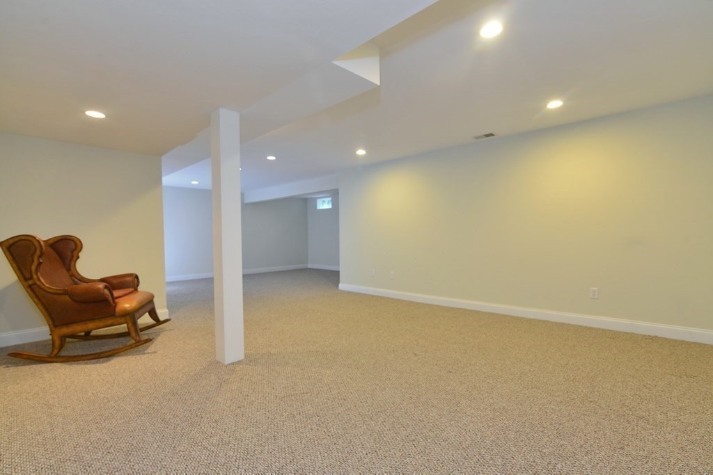 15 Hathaway Pond Circle, Unit 15 Rochester, MA 02770 - Photo 17 of 36 an empty room with furniture and air conditioner