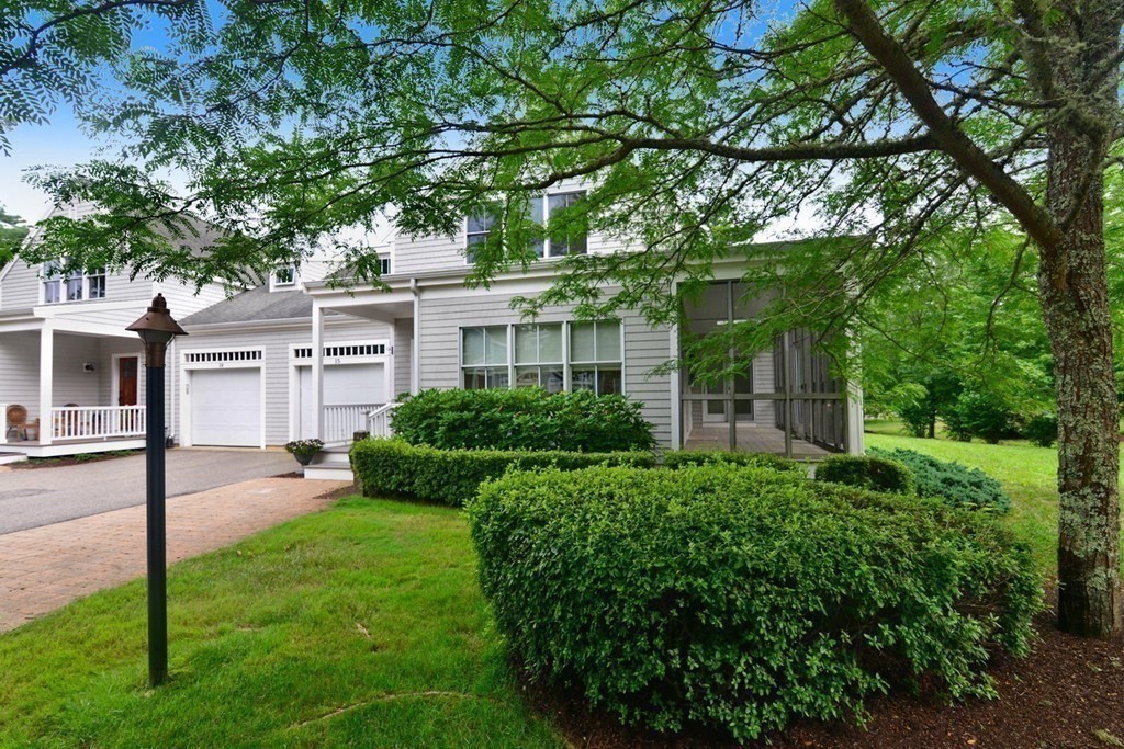15 Hathaway Pond Circle, Unit 15 Rochester, MA 02770 - Photo 2 of 36 a view of backyard of house with green space
