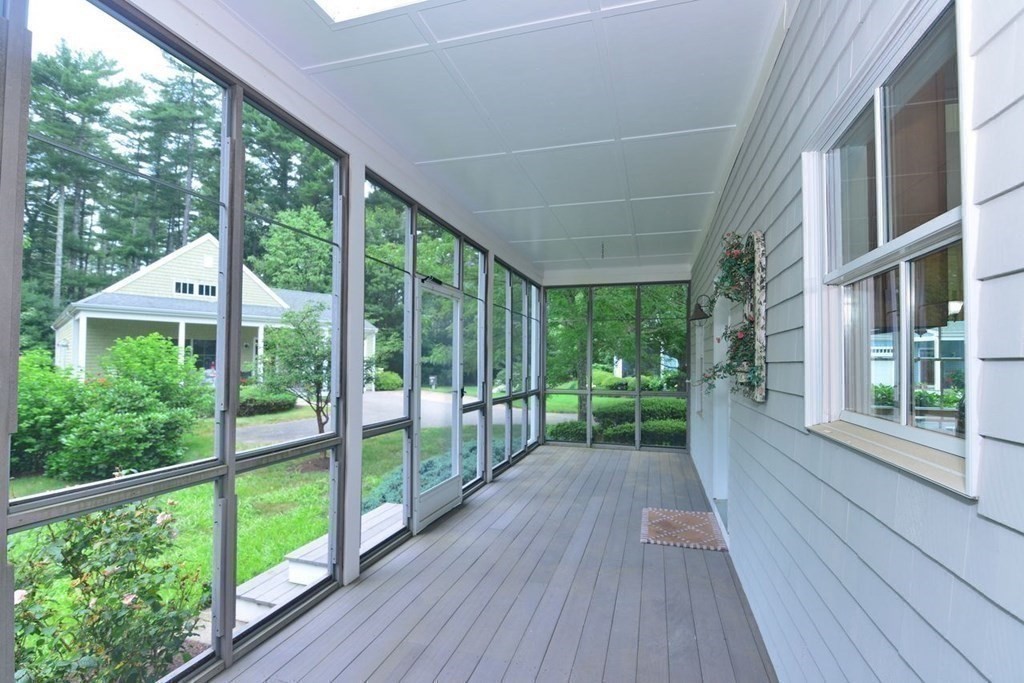 15 Hathaway Pond Circle, Unit 15 Rochester, MA 02770 - Photo 23 of 36 a view of balcony with wooden floor and outdoor space