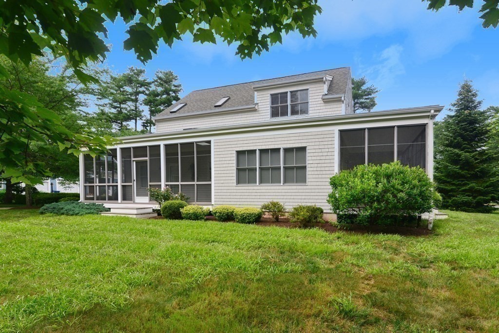 15 Hathaway Pond Circle, Unit 15 Rochester, MA 02770 - Photo 24 of 36 front view of a house with a yard