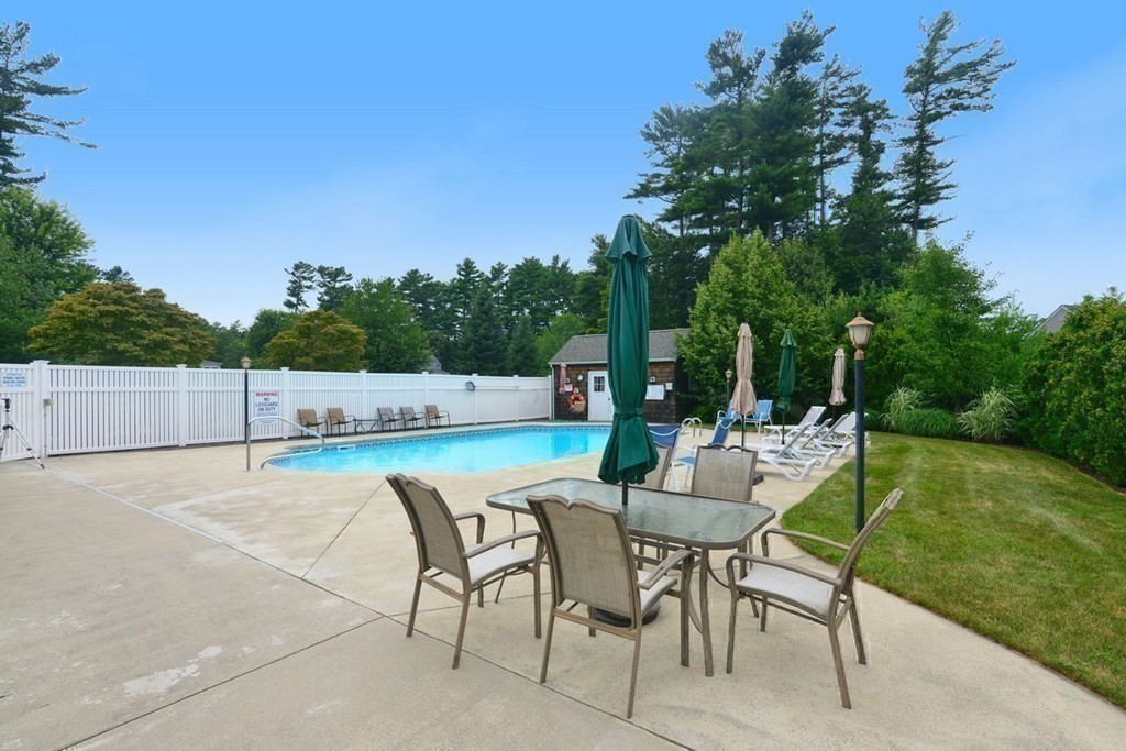 15 Hathaway Pond Circle, Unit 15 Rochester, MA 02770 - Photo 25 of 36 a view of a chairs and table in the patio