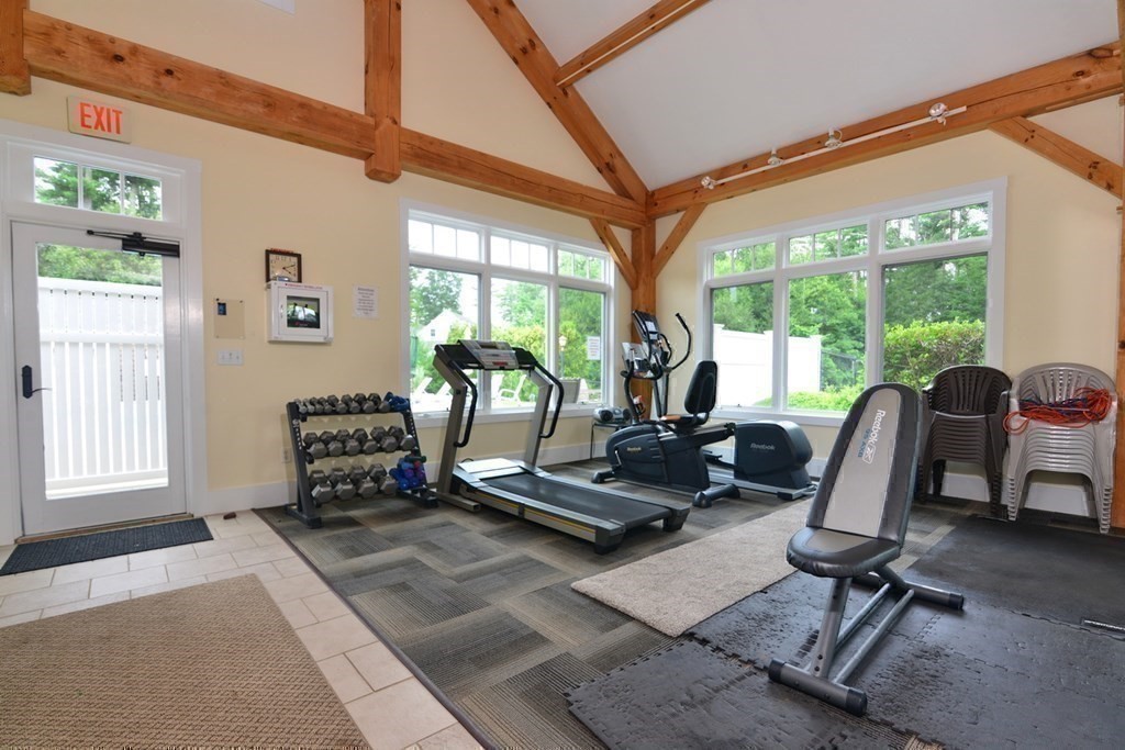 15 Hathaway Pond Circle, Unit 15 Rochester, MA 02770 - Photo 28 of 36 a work room with furniture and floor to ceiling windows
