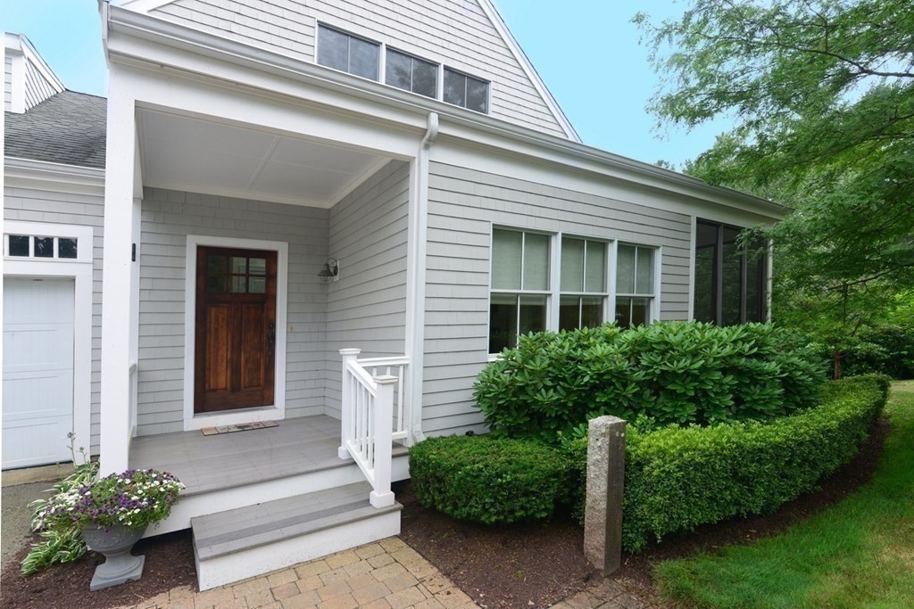 15 Hathaway Pond Circle, Unit 15 Rochester, MA 02770 - Photo 5 of 36 a view of a house with potted plants